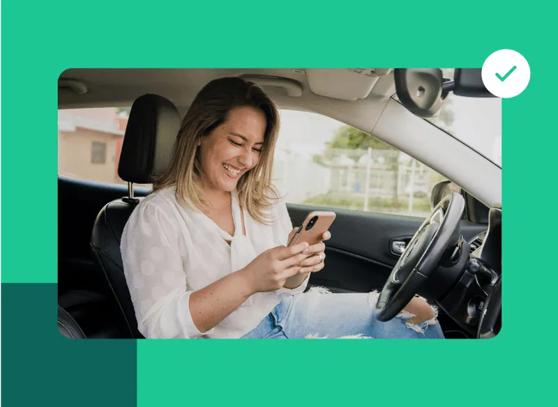 A woman talking on a cell phone while holding a cell phone to her ear.